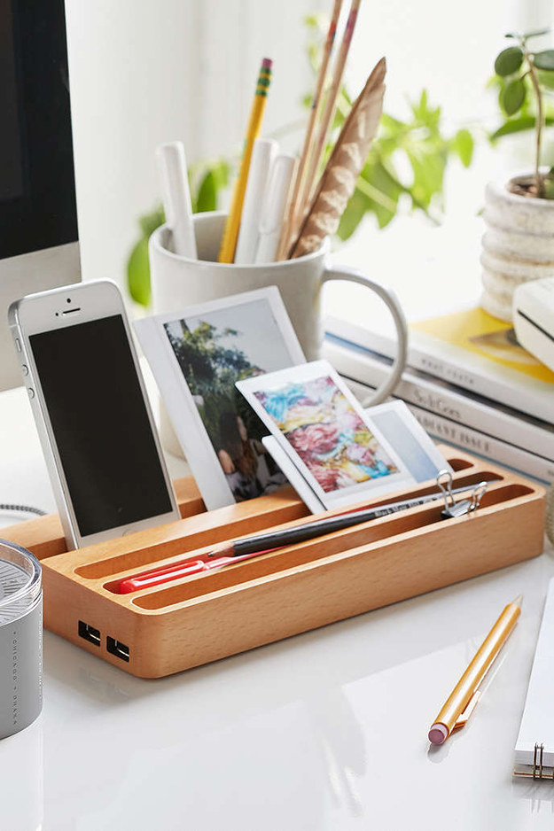 This wooden charging station with two USB ports to keep your devices in one place ($50).