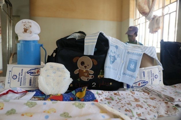 Kemisa Hidaya from Uganda has a nylon sheet ready for the birth, razor blades, cotton rolls for cleaning, disinfectant, and soap to clean the room after the birth. Hidaya also has the baby clothes on hand and only brought two pairs of gloves out of the required 10 due to budget restraint.