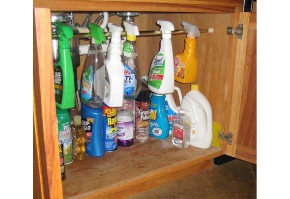 Use a tension rod under the sink to double your cleaning product capacity.
