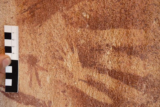 The walls of Wadi Sura II are covered with hundreds of hand stencils, as well as images of people, wild animals and unusual headless beasts