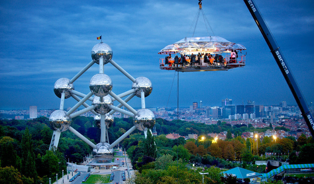Dinner In The Sky is a mobile restaurant in which guests are hoisted and strapped into dining chairs 160 feet up in the air. The idea was first seen in Belgian and has since expanded in cities around the world in limited run periods.