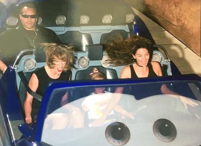 Taylor Swift has a blast on a rollercoaster - but her bodyguard doesn't see the fun side