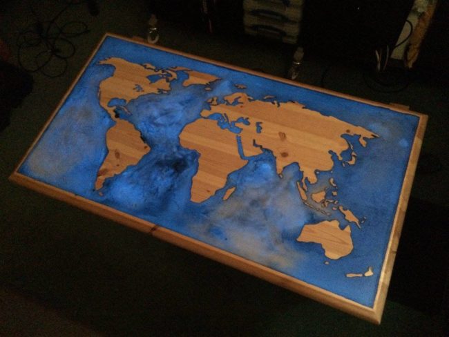 This <a href="https://www.reddit.com/r/DIY/comments/4ecdmn/glowinthedark_epoxy_and_pine_world_map_coffee/" target="_blank">world map coffee table</a> is surrounded by glow-in-the-dark resin which is fitting for the ocean.