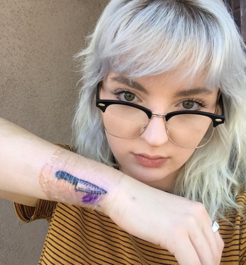 In May she got a tattoo of a knife on her arm. Her father saw it for the first time on Thursday when they went to the zoo together.