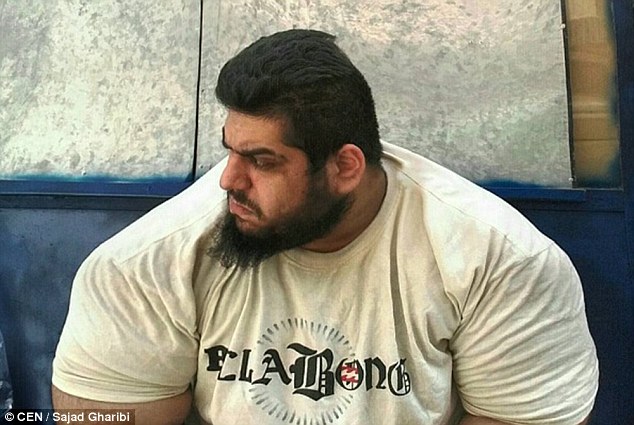 Hunch: Like the Hulk, Gharibi's back and shoulder muscles protrude giving him the appearance of having a little neck