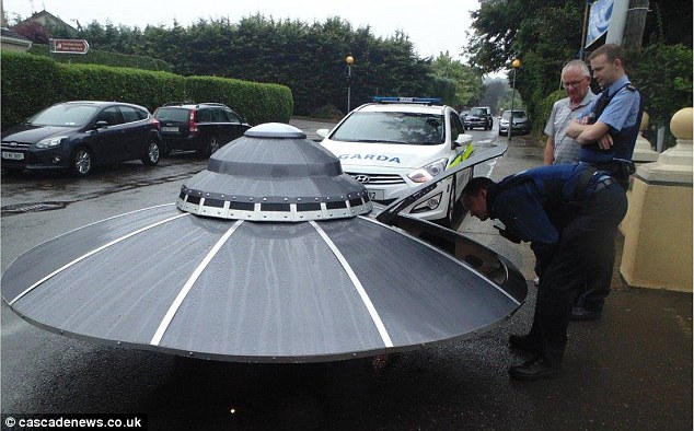 Any aliens in there? The Garda pull over the saucer for an closer inspection on the street