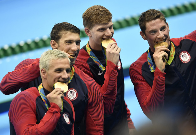 Because you can only have so many dorky photos of medalists just standing there and smiling, right?