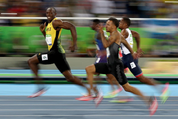 The world's fastest man, Usain Bolt, competed in the men's 100-meter semi final today just 30 minutes before winning gold in the final, and breezed past the competition with absolute ease. So much so, he took time to turn his head and give his competitors a cheeky smile.