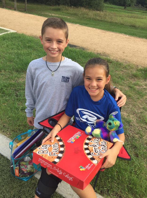 Cole surprised Sherri with the letter — as well as a cookie cake and a teddy bear — at one of her soccer practices, where she's watching from the sidelines until she's recovered.