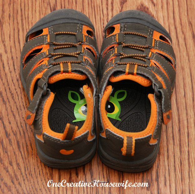 Cut a sticker down the middle, then put one half inside each of your kid's shoes. This way they'll always know which shoe goes on which foot.