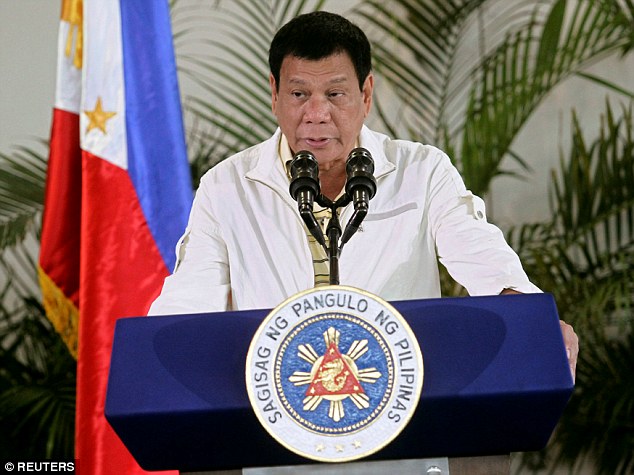 President Rodrigo Duterte (pictured today) warned Barack Obama not to ask about extrajudicial killings, or 'son of a bitch I will swear at you' when they meet in Laos during a regional summit