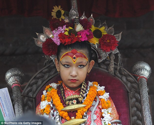 On her throne. The goddess attends the last day of chariot pulling festival of Rato Machindranath 'God of Rain' at Kumaripati, Patan, Nepal in July
