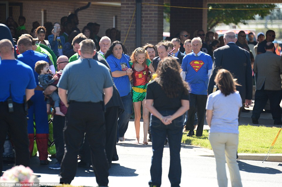 Friends support Jacob's mother Renae Hall (above) after an emotional funeral for the six-year-old, who died of his injuries on Saturday after being struck by a bullet in a main artery in his thigh