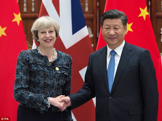 Distant: China and Britain's relationship has come under strain but Donald Trump's victory is likely to be welcomed by Chinese President Xi Jinping, who is pictured above with prime minister Theresa May