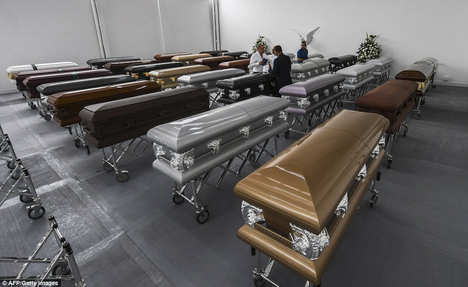 Heartbreaking pictures show the coffins laid out in the Colombian city's San Vicente Mortuary with chairs dressed in white left out for grieving friends and relatives