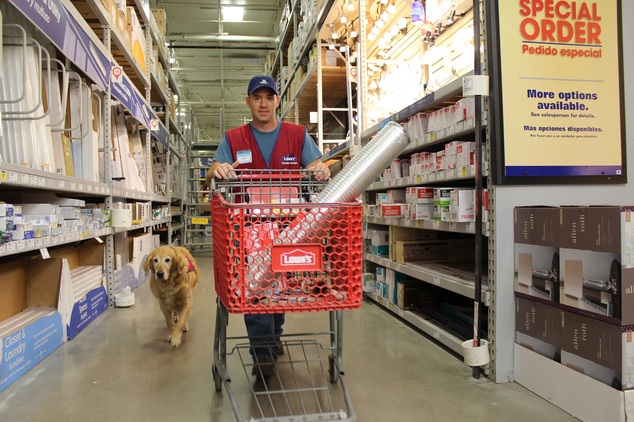 Charlotte follows Clay  as he returns items to shelves at a Lowe's store in Abiline, Texas