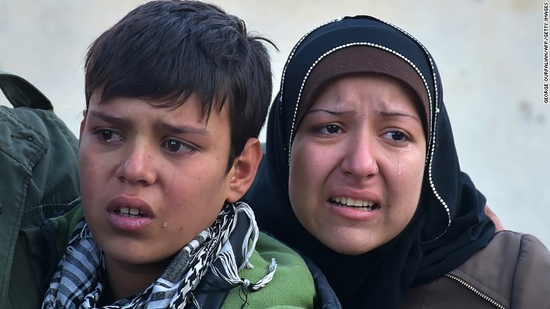 Syrian residents fleeing eastern Aleppo in fear on December 7.