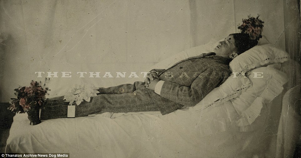 This young man has been laid out in his best suit. It is unclear if the mark on his forehead is a gunshot wound or just a mistake on the daguerreotype