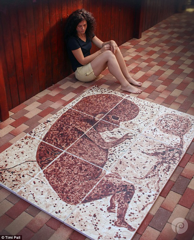 Romanian artist Timi Páll created a massive painting of a baby using her menstrual blood called 'The Diary of my Period'