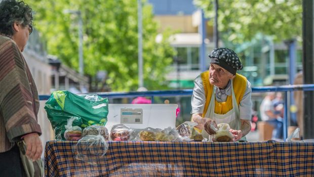With sweet buns and doughnuts donated from the bakery, Stasia Dabrowski serves up lunch in Garema Place.