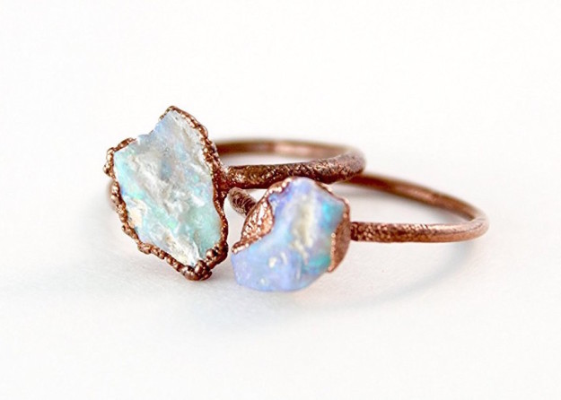 An iridescent raw opal ring that's a little rough around the edges.