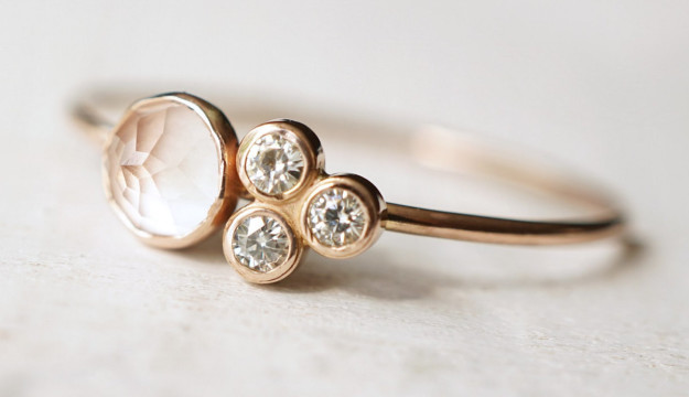 A rose quartz and moissanite ring that confirms that four is not a crowd.