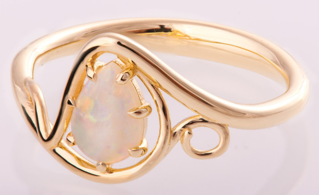 A gorgeous opal ring intertwined in ribbons of gold.