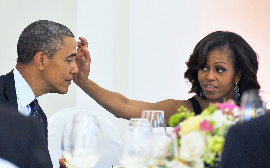 First Lady Michelle Obama Wipes Something From President Obama’s Forehead During A Dinner At The Schloss Charlottenburg Palace In Berlin, Germany On June 19, 2013