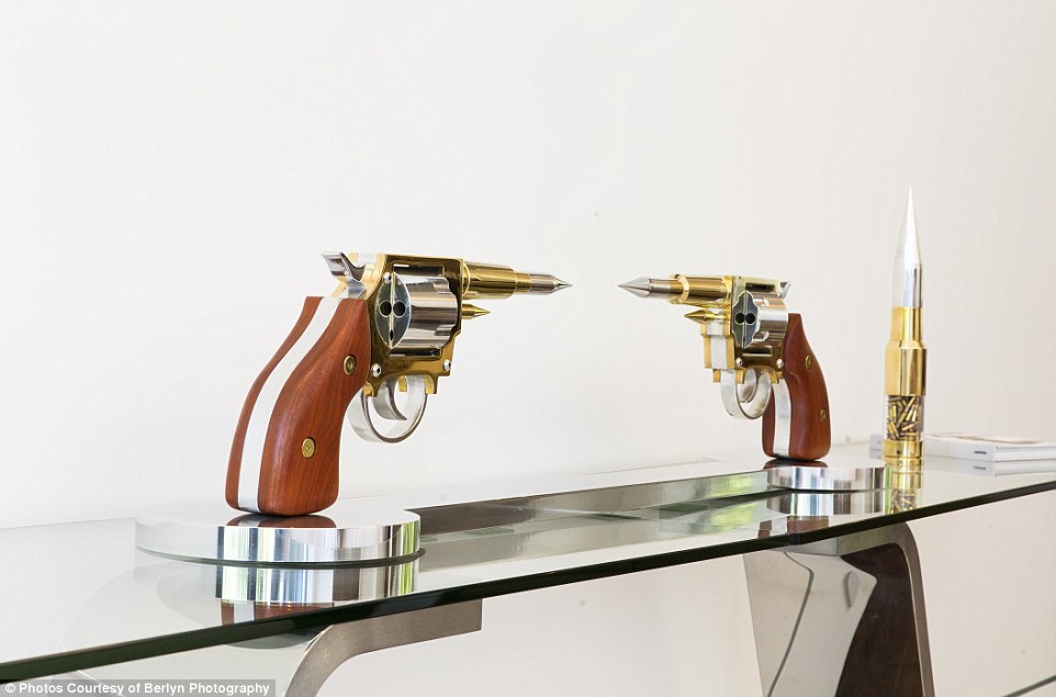 Two more of Gale Hart's firearm-themed works of art can be found in a different part of the extravagant, artsy property