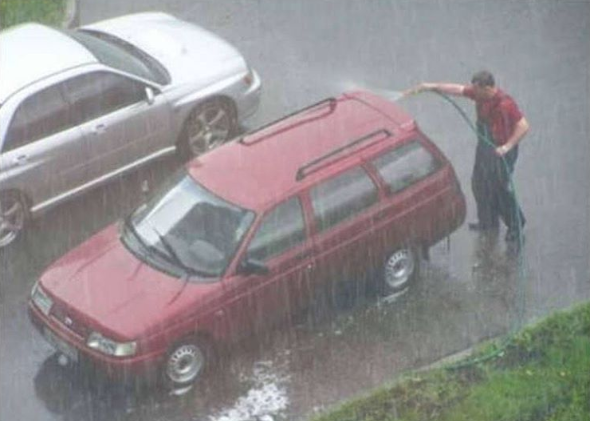 This dude who's actually washing his car in THE RAIN.