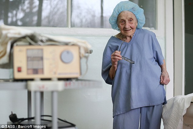 The tiny surgeon, who is only 150cm (4ft 9in) tall, has a step to help her reach her patients