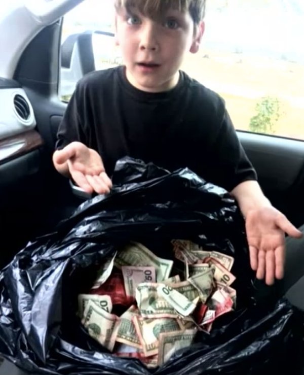 A 7-year-old boy is being hailed as a hero after finding a bag of stolen cash at a Myrtle Beach gas station. 

Griffin Steele, 7, was at the gas station with his father when he spotted a $20 bill splattered with red ink on the ground. 

He showed it to his dad, who agreed there was something odd about the find. 

Later, when Griffin went to throw away the wrapper to his Gatorade bottle, he saw that the trash can was full of money.