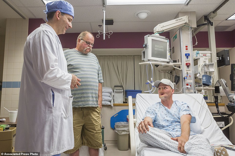 Preparations for the operation: Andy Sandness talks with his father, Reed Sandness, and Dr. Samir Mardini, before the 60-strong team went to work in June of 2016. In the process leading up to the surgery, Mardini tried to temper his patient's enthusiasm. 'Think very hard about this,' he said. Only a few dozen transplants have been done around the world'