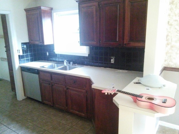 This gloomy-looking kitchen with "sticky" cabinets...