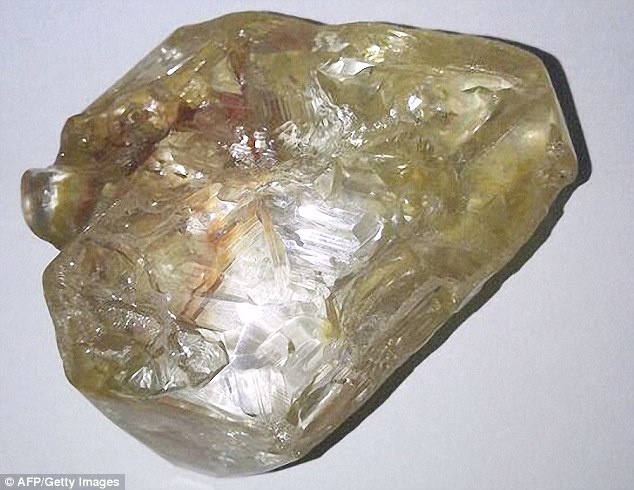 Christian pastor Emmanuel Momoh found a 706-carat diamond in a mine in Kono, Sierra Leone, which could be the tenth largest ever found (pictured)