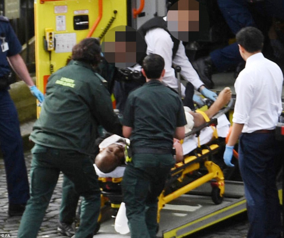 This was the scene as the attacker was taken away to hospital following the attack. He killed four people