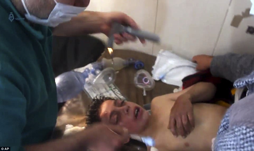 A Syrian doctor helped a boy following the suspected attack, which has been described as one of the worst in the country's six-year civil war