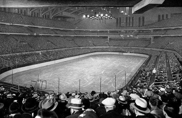 14 -  Fans pack Chicago Stadium, at the time the largest indoor sports arena in the world, prior to a hockey game between the Chicago Blackhawks and the Boston Bruins, 1930