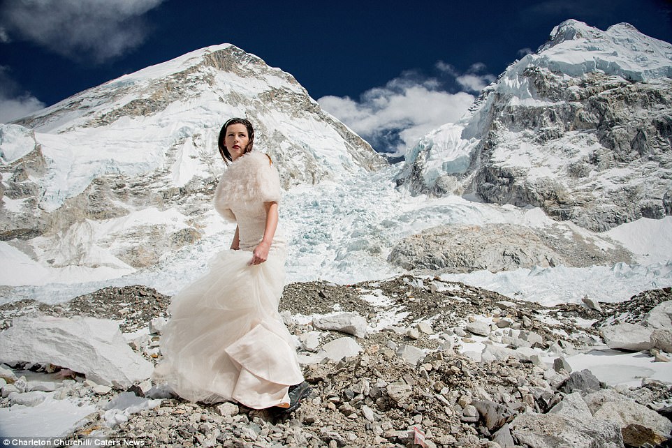 Dramatic: The newlyweds were captured in their wedding finery against the breathtaking backdrop of the mountain range