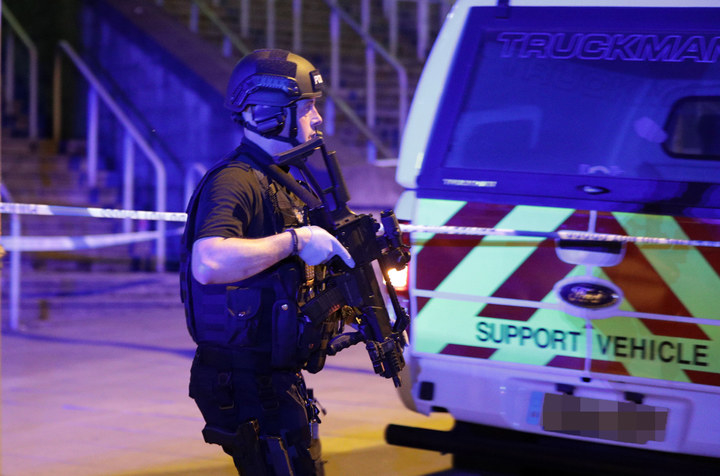 Police near the Manchester Arena after reports of an explosion.