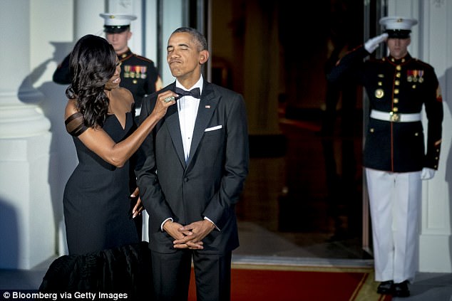 Obama also shared the story behind the viral photo (above) of her adjusting his bow tie just before the September 2015 state dinner. She said she was 'bored' while waiting for cars to roll in and 'thought, let me make sure my husband looks good'