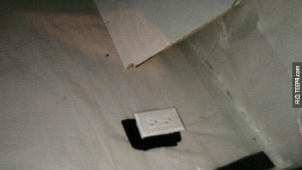 The walls, floor and ceiling are covered in soundproofing board and plastic tarp, all white. There are 3-4 outlets in the room with a small raised area the size of a single bed. Strange for a crawlspace.