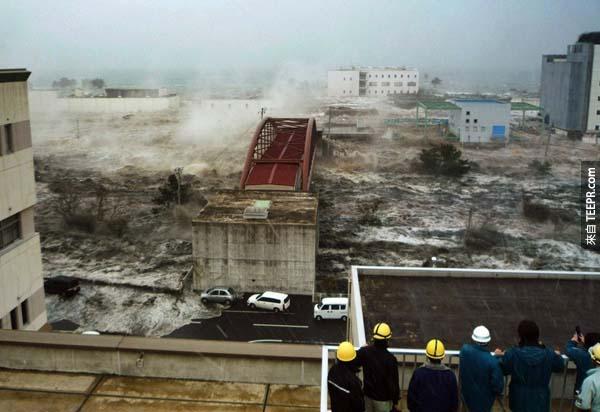 16.) Tsunami flood waters destroy cities in Japan.