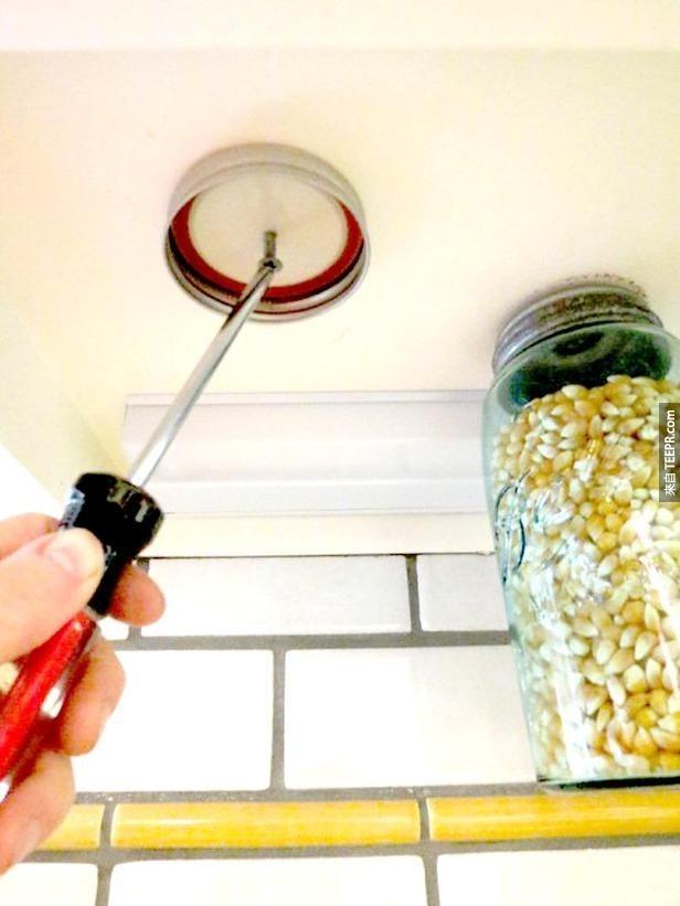 Hang Mason jar lids on the underside of your cabinets for decorative storage.