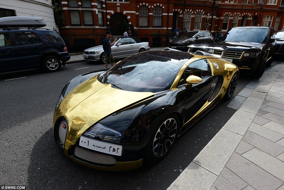 A gold and black Saudi-owned Bugatti Veyron - which can sell for up to £1million - was parked in a street in Kensington in August causing many to stop and take photos