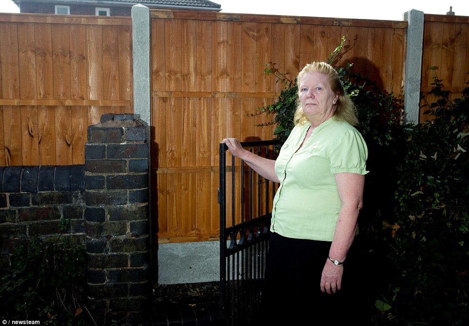 Wendy Collins, from Brownhills, West Midlands, has been left unable to use her garden gate after her neighbour built a fence across it 