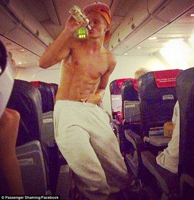 'Disrespectful' behavior: From boarding without socks to downing a drink bare-chested (pictured), these images show some of the most disgusting airline passengers to have recently taken to the skies
