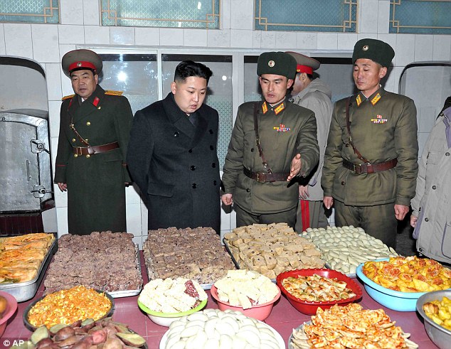 Hungry, sir? Kim Jong-un inspects a dining room at Seoul Ryu Kyong Su 105 Guards Tank Division of the Korean People's Army in North Korea