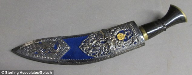 Regal: Another item up for sale is this regimental silver-mounted Gurkha kukri with Royal Cypher of Queen Elizabeth II. Its rear pouch contains two horn-handle knives.