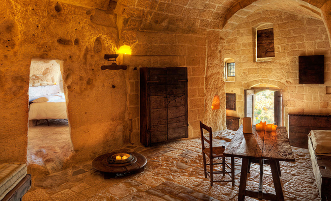 The Sassi of Matera are a network of carved buildings dating to the early Middle Ages. This hotel is a restored set of 18 rooms, all adhering to a strict conservation policy. The rooms are candlelit and lack TVs and fridges to better preserve the historical atmosphere. They are all connected via terraces and stairways.